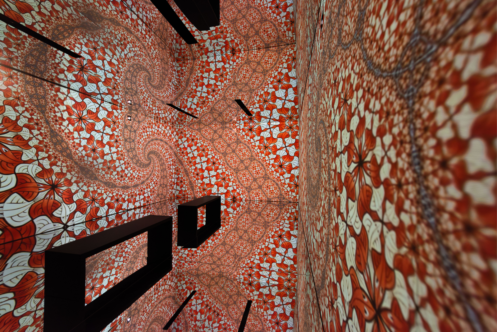Red fractal tessellation projected on the infinity room walls